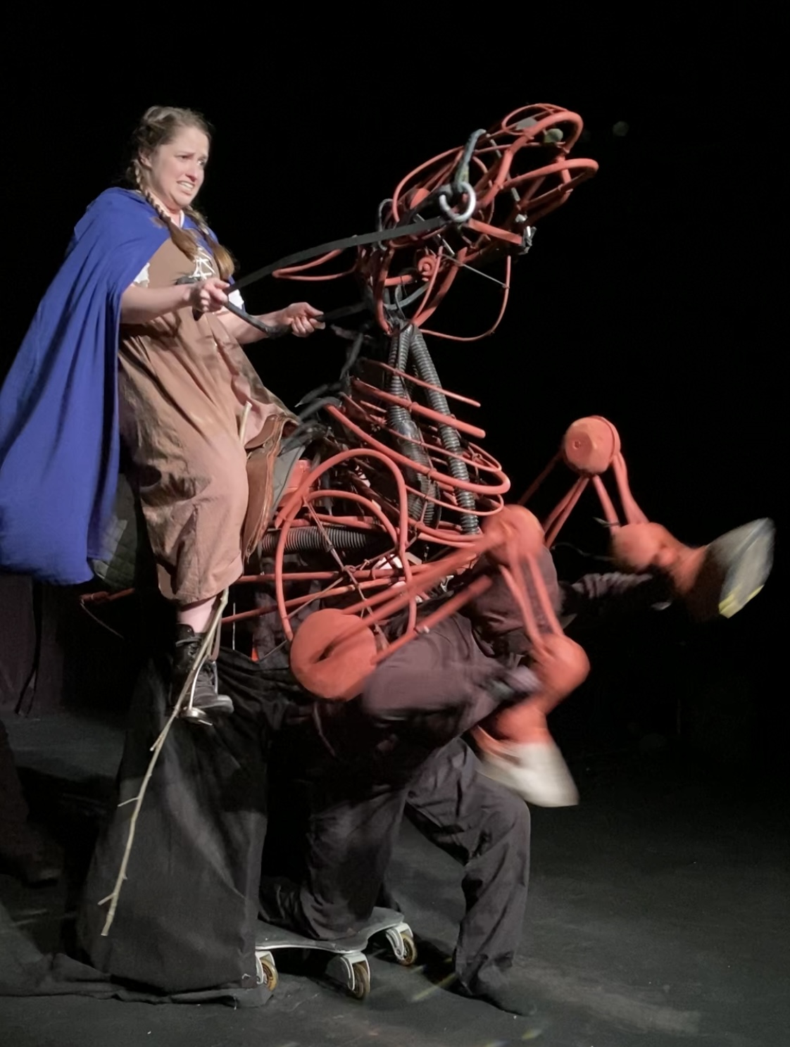 a photo of the stage production of Sybil's Ride featuring the horse puppet and leading actress